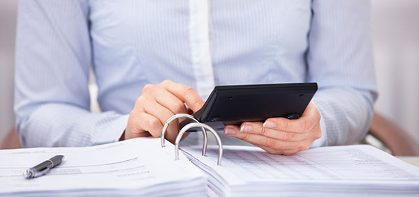 Businessperson checking an invoice in office